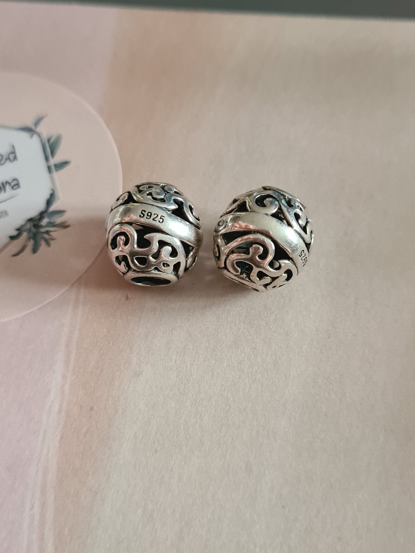 Silver Pair of Openwork Swirl Charms